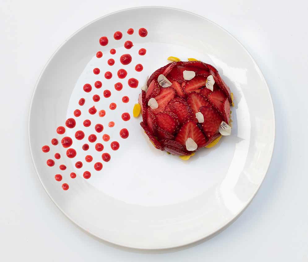 White chocolate pannacotta with fresh strawberries and strawberries gel